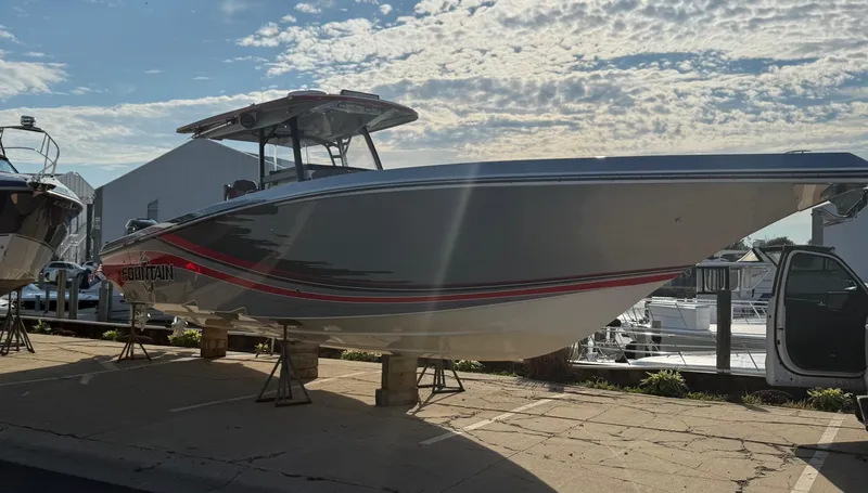  Yacht Photos Pics 2022 Fountain 38 SC boat displayed outdoors under a partly cloudy sky.