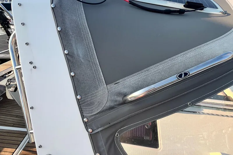 Wind Walker Yacht Photos Pics Close-up of 2013 Beneteau Oceanis 41 sailboat's cockpit cover and stitching details.