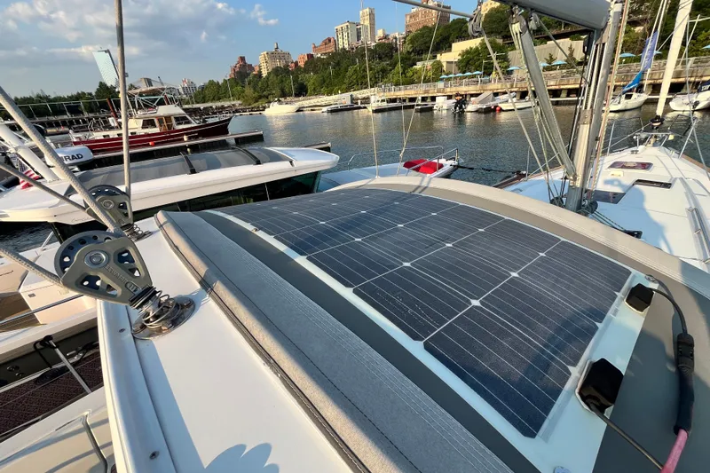 Wind Walker Yacht Photos Pics 2013 Beneteau Oceanis 41 sailboat with solar panels docked in a marina.