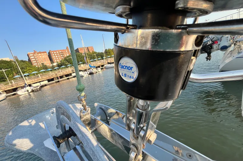 Wind Walker Yacht Photos Pics Close-up of a 2013 Beneteau Oceanis 41 sailboat's anchor mechanism in a marina.