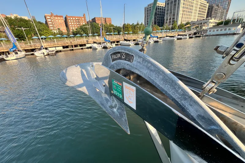 Wind Walker Yacht Photos Pics Beneteau Oceanis 41 (2013) with Vulcan anchor at marina, cityscape background.