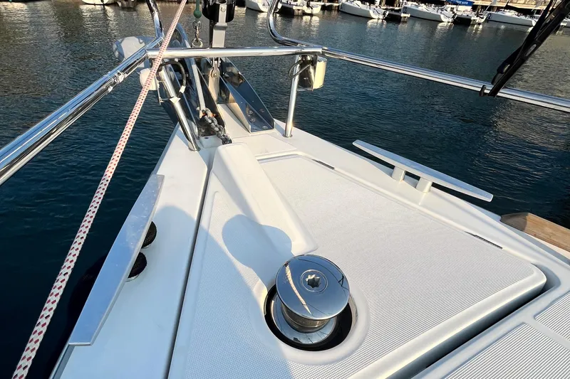 Wind Walker Yacht Photos Pics Bow of 2013 Beneteau Oceanis 41 yacht with winch and railing, docked in marina.