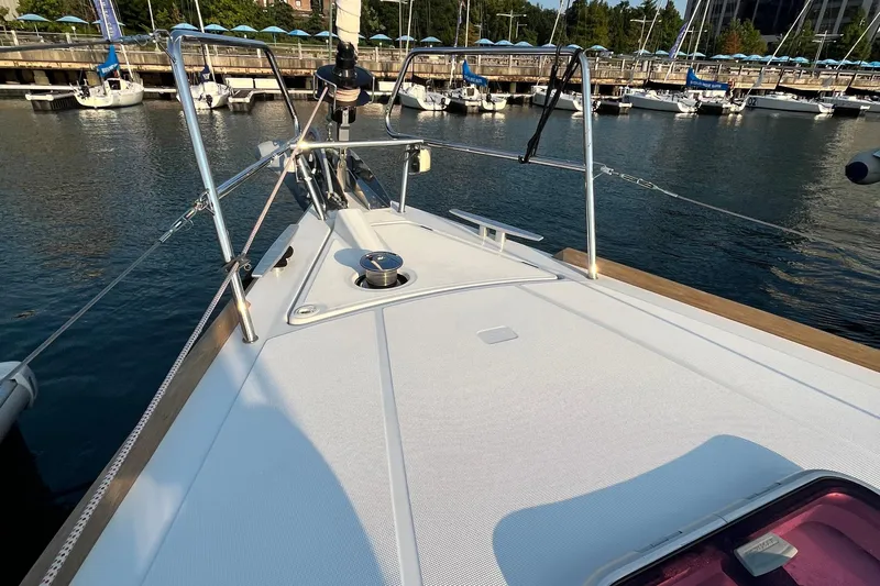 Wind Walker Yacht Photos Pics 2013 Beneteau Oceanis 41 sailboat deck at marina, showcasing sleek design and moored yachts.