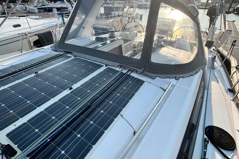 Wind Walker Yacht Photos Pics 2013 Beneteau Oceanis 41 sailboat with solar panels on deck, docked in marina.