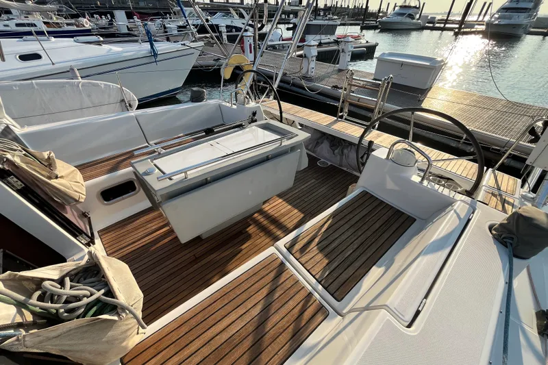 Wind Walker Yacht Photos Pics Cockpit of 2013 Beneteau Oceanis 41 sailboat with wooden deck and dual steering wheels.