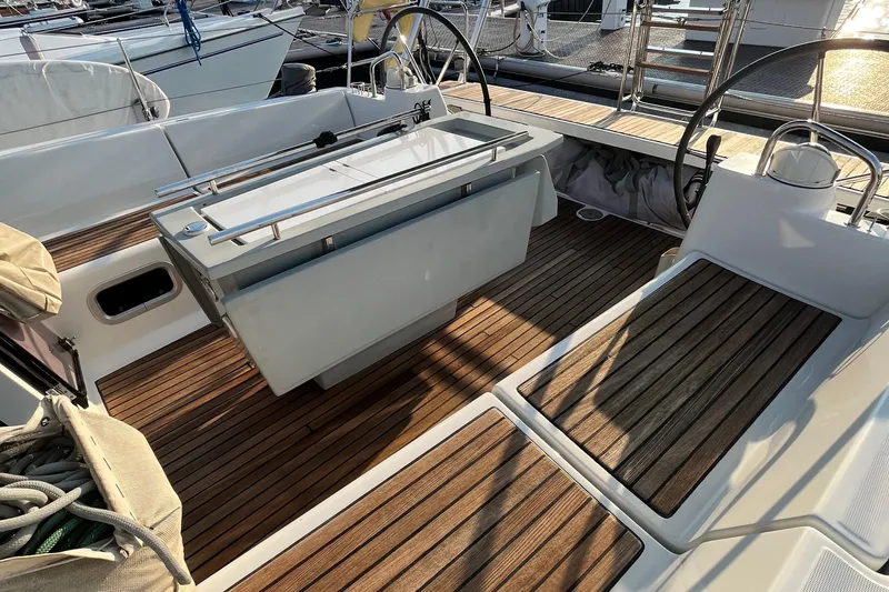 Wind Walker Yacht Photos Pics Cockpit of 2013 Beneteau Oceanis 41 sailboat with wooden deck and dual steering wheels.