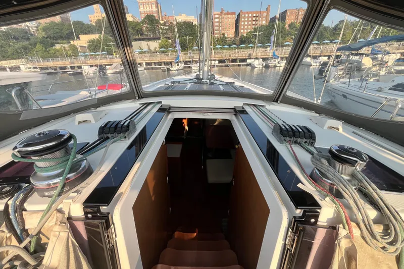 Wind Walker Yacht Photos Pics 2013 Beneteau Oceanis 41 sailboat cockpit with marina view, showcasing winches and rigging.
