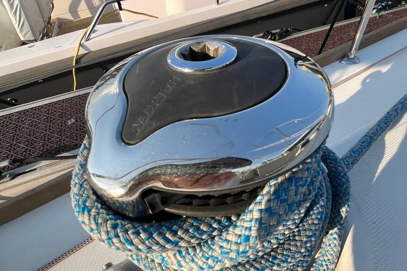 Wind Walker Yacht Photos Pics Close-up of a winch on a 2013 Beneteau Oceanis 41 sailboat, with blue rope.