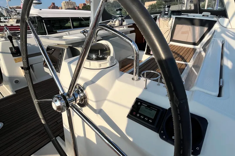 Wind Walker Yacht Photos Pics Cockpit view of 2013 Beneteau Oceanis 41 sailboat with steering wheel and navigation instruments.