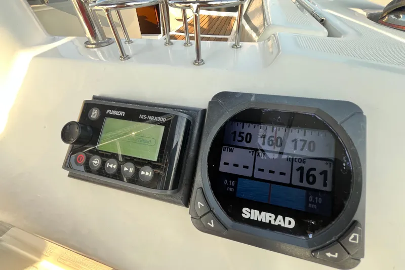 Wind Walker Yacht Photos Pics Control panel on 2013 Beneteau Oceanis 41 sailboat with Simrad and Fusion displays.