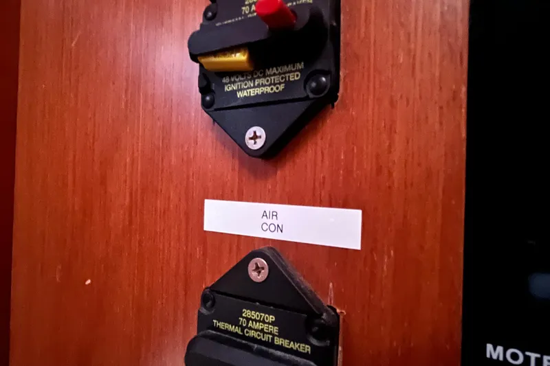 Wind Walker Yacht Photos Pics Circuit breakers labeled "Air Con" on 2013 Beneteau Oceanis 41 yacht.