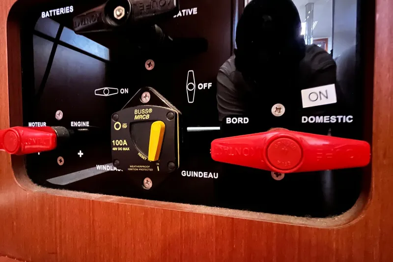 Wind Walker Yacht Photos Pics Control panel of a 2013 Beneteau Oceanis 41 sailboat with switches and labels.