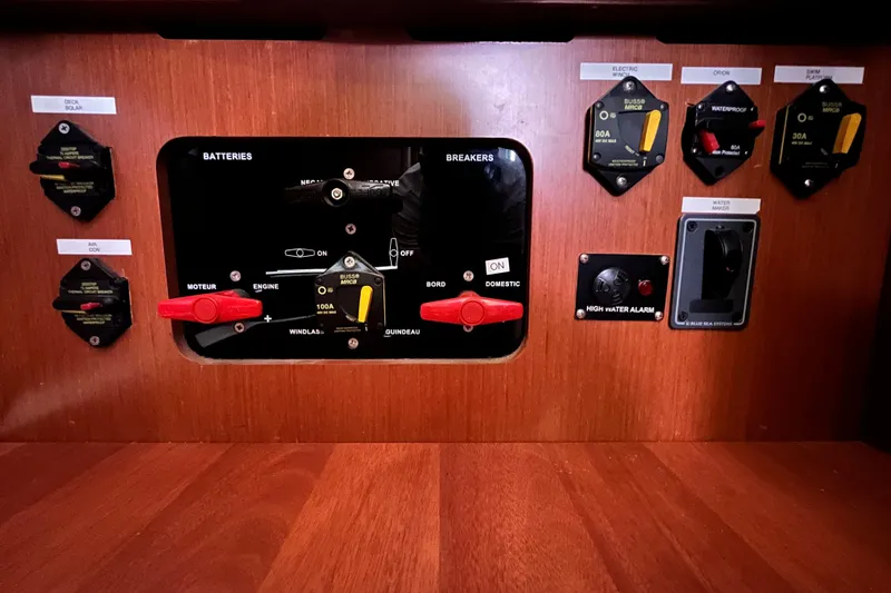 Wind Walker Yacht Photos Pics Control panel of a 2013 Beneteau Oceanis 41 sailboat, featuring battery and breaker switches.