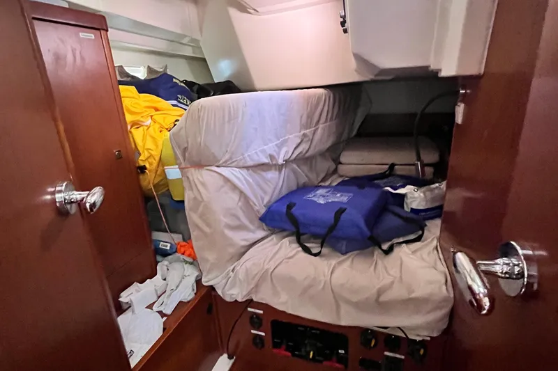 Wind Walker Yacht Photos Pics Cabin interior of 2013 Beneteau Oceanis 41 yacht with storage and bedding.
