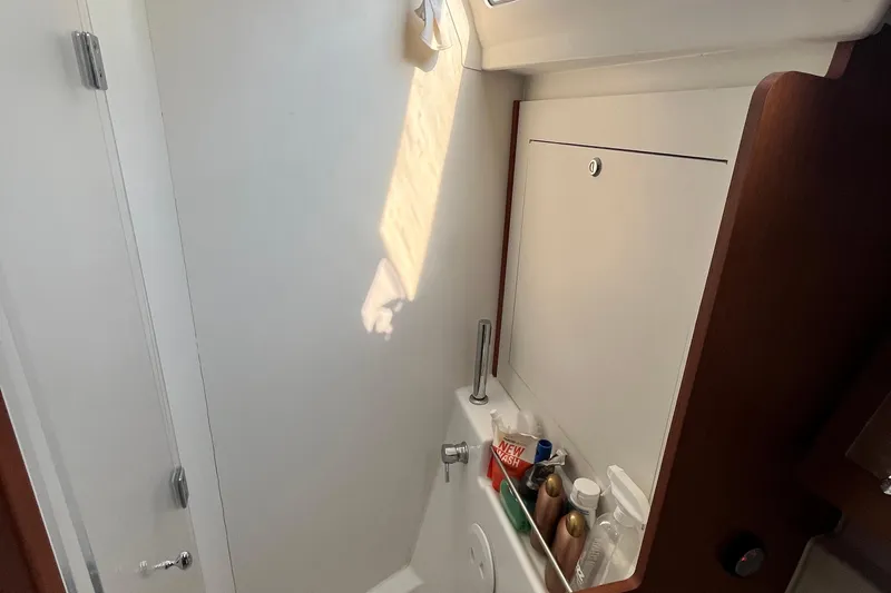 Wind Walker Yacht Photos Pics Interior of 2013 Beneteau Oceanis 41 yacht bathroom with storage and toiletries.