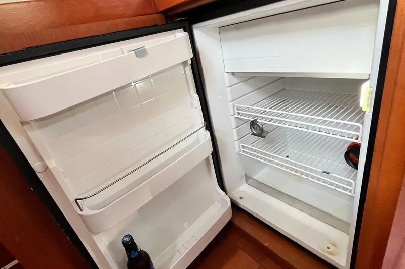 Wind Walker Yacht Photos Pics Refrigerator inside 2013 Beneteau Oceanis 41 yacht, partially stocked with beverages.