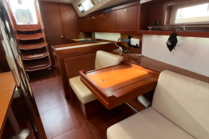 Wind Walker Yacht Photos Pics Interior of 2013 Beneteau Oceanis 41 yacht with wooden furnishings and seating area.