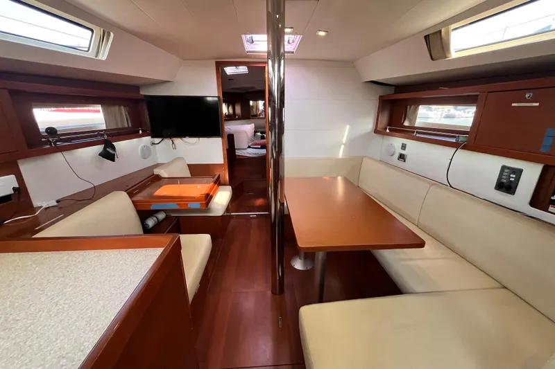 Wind Walker Yacht Photos Pics Interior of 2013 Beneteau Oceanis 41 yacht with modern seating and dining area.