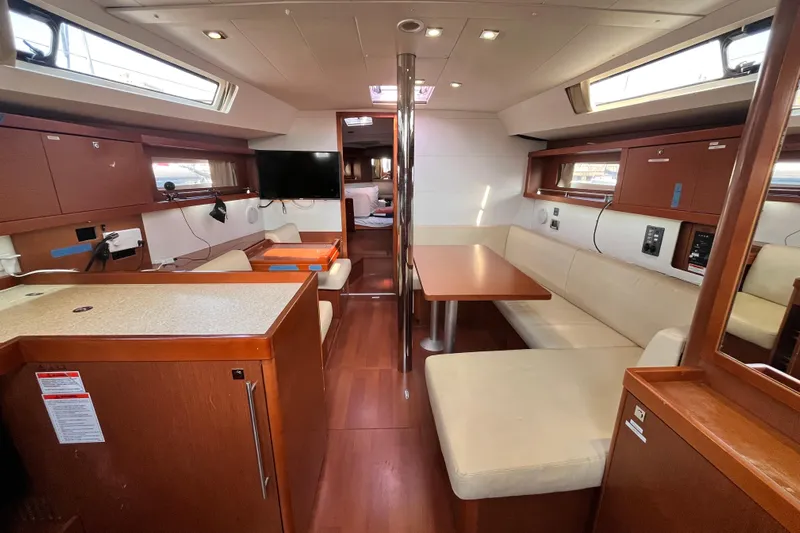 Wind Walker Yacht Photos Pics Interior of 2013 Beneteau Oceanis 41 yacht with modern seating and dining area.