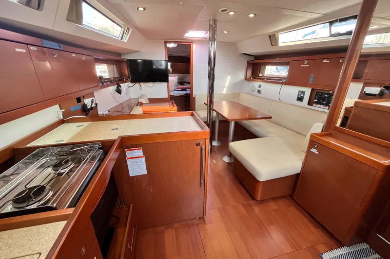 Wind Walker Yacht Photos Pics Interior of 2013 Beneteau Oceanis 41 yacht with kitchen, seating, and dining area.