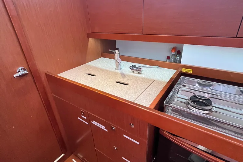 Wind Walker Yacht Photos Pics Galley kitchen in 2013 Beneteau Oceanis 41 yacht with sink and stove.