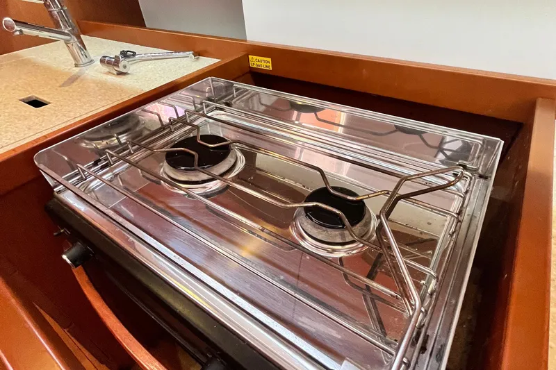 Wind Walker Yacht Photos Pics Stove in 2013 Beneteau Oceanis 41 yacht kitchen, featuring dual burners and sleek design.