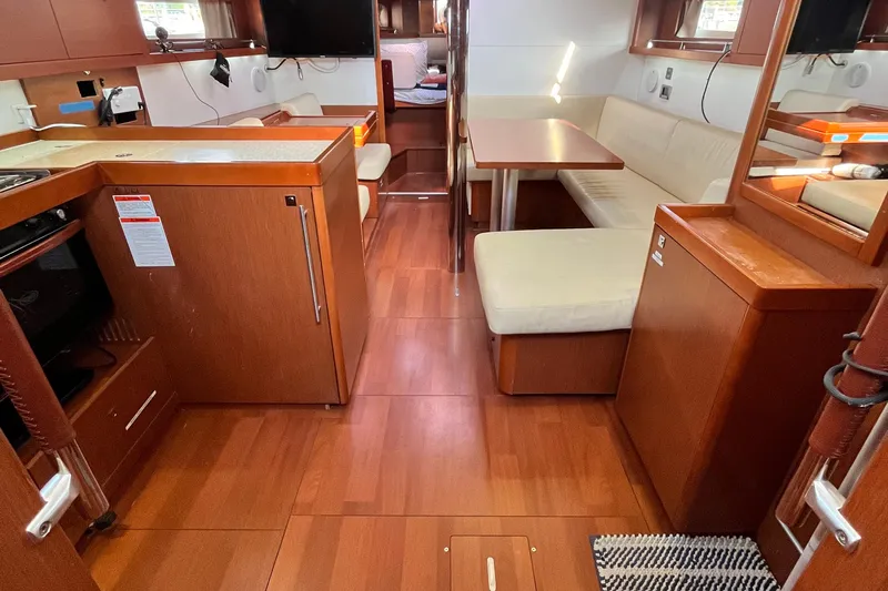 Wind Walker Yacht Photos Pics Interior of 2013 Beneteau Oceanis 41 yacht with wood finish and cozy seating area.
