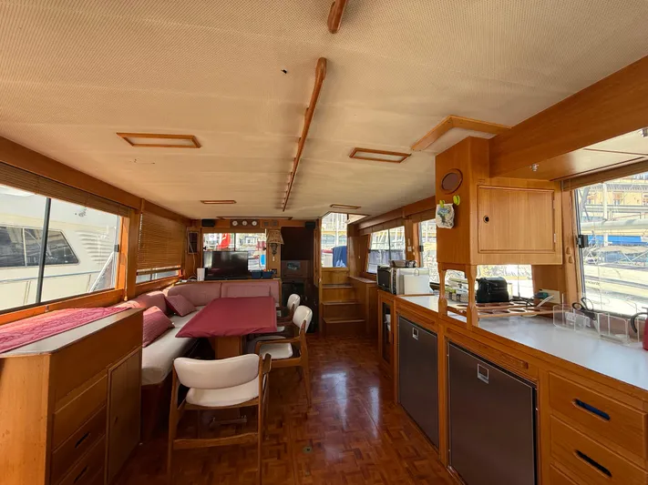 Aramis II Yacht Photos Pics Interior of a 1990 Grand Banks 49 yacht, featuring a spacious, wood-finished living area.