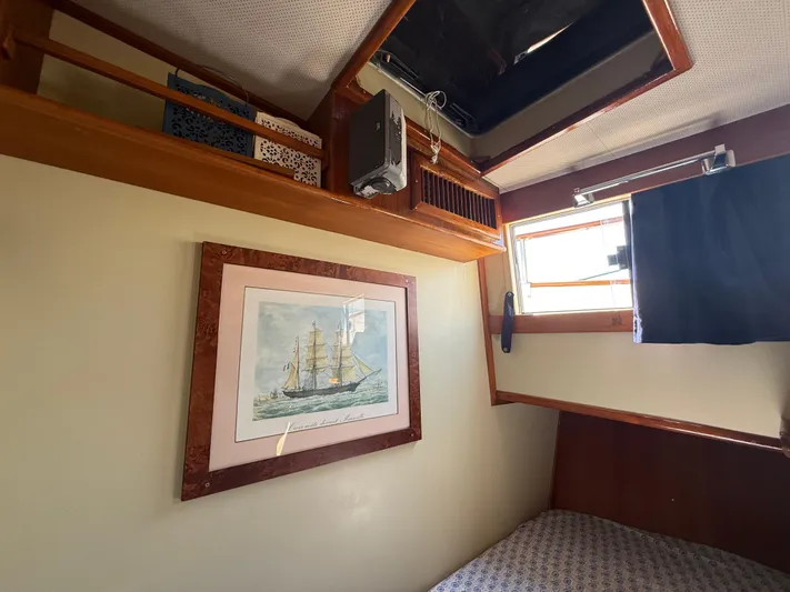 Aramis II Yacht Photos Pics Interior of 1990 Grand Banks 49 with nautical artwork and wooden accents.