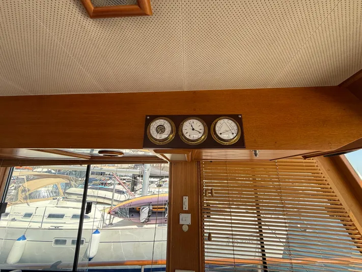 Aramis II Yacht Photos Pics Interior of 1990 Grand Banks 49 yacht with nautical instruments and marina view.