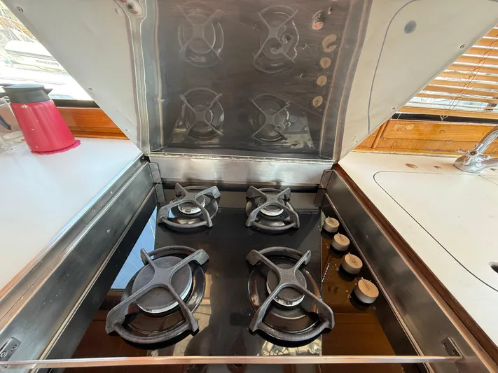 Aramis II Yacht Photos Pics Stainless steel stove with four burners on a 1990 Grand Banks 49 yacht.