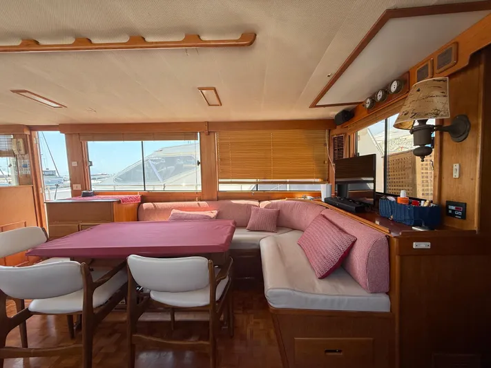 Aramis II Yacht Photos Pics Interior of 1990 Grand Banks 49 yacht with cozy seating and dining area.
