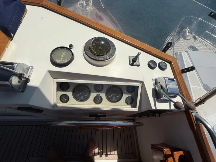 Aramis II Yacht Photos Pics Helm of 1990 Grand Banks 49 yacht with gauges and controls.