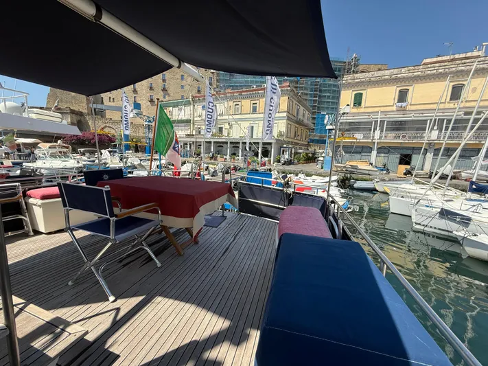 Aramis II Yacht Photos Pics Deck view of 1990 Grand Banks 49 yacht in a sunny marina setting.