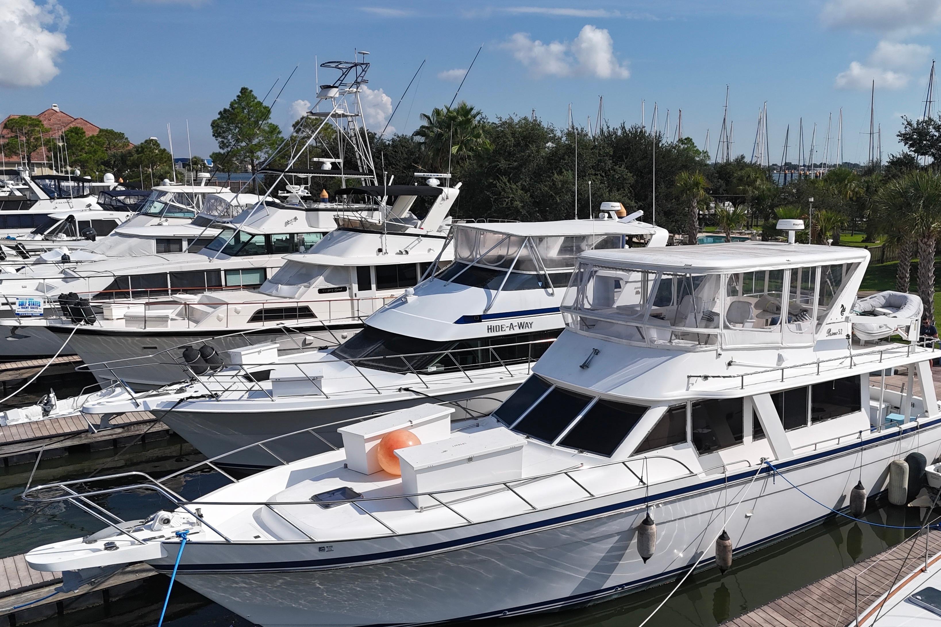 Docked Prima 52 Seahorse yacht, 2001 model, surrounded by other boats in a marina.