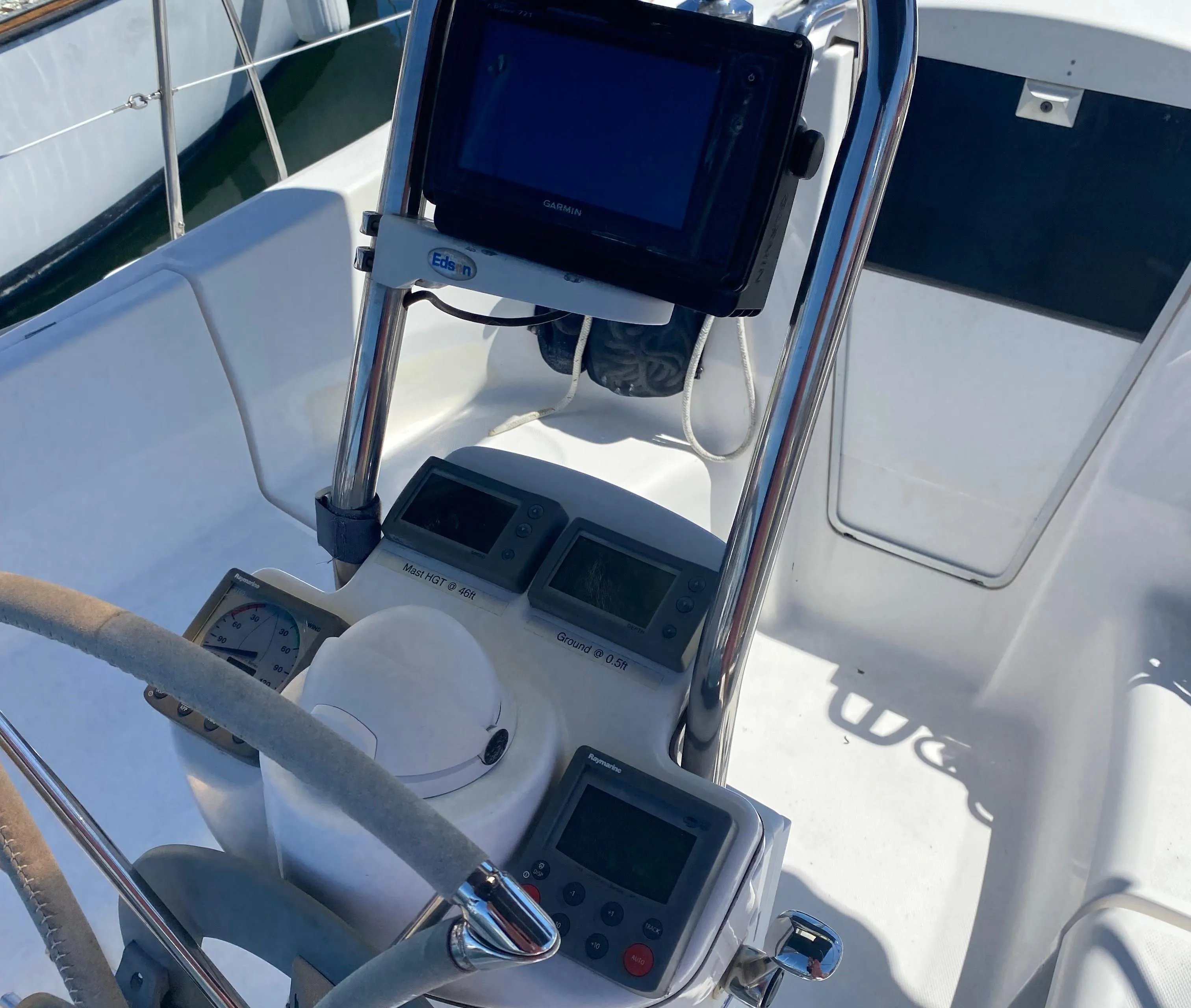 Hunter 31-2 2009 sailboat cockpit with navigation instruments and steering wheel.