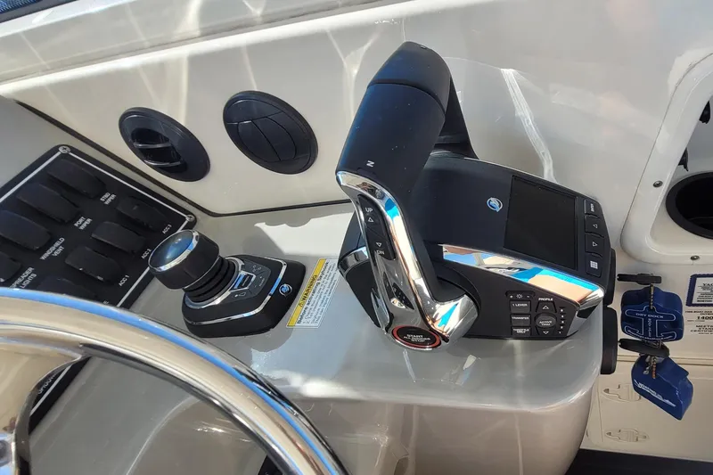 Outta Line Yacht Photos Pics 2017 Boston Whaler 315 Conquest helm controls with joystick and throttle.