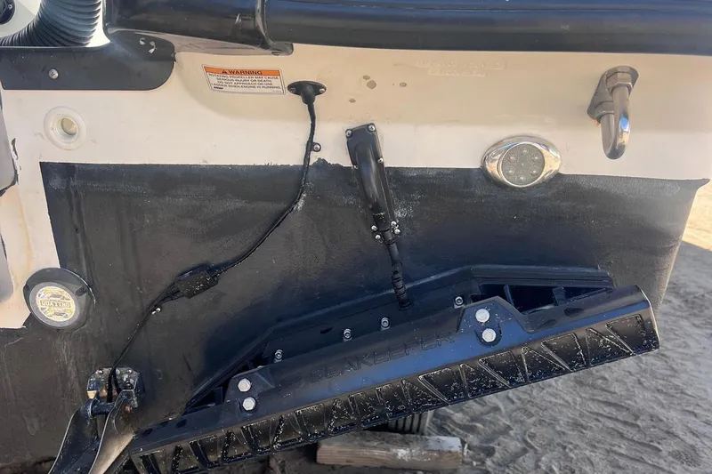 Outta Line Yacht Photos Pics 2017 Boston Whaler 315 Conquest boat transom with Seakeeper stabilizer and wiring.