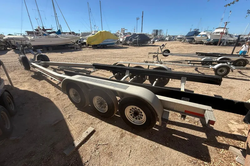Outta Line Yacht Photos Pics Boat trailers in a marina, suitable for a 2017 Boston Whaler 315 Conquest.