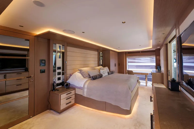 Heliophilia Yacht Photos Pics Luxurious bedroom interior of 2024 Sirena 88 yacht with modern design and ambient lighting.