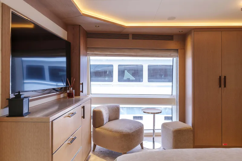 Heliophilia Yacht Photos Pics Luxurious interior of 2024 Sirena 88 yacht with modern furnishings and large window view.