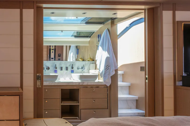Heliophilia Yacht Photos Pics Luxurious bathroom interior of 2024 Sirena 88 yacht with modern fixtures and natural lighting.