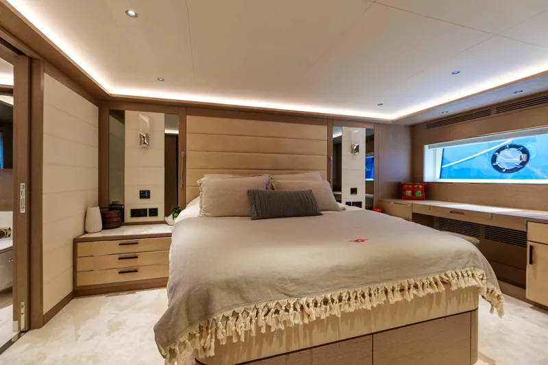 Heliophilia Yacht Photos Pics Luxurious bedroom interior of 2024 Sirena 88 yacht, featuring elegant design and modern amenities.