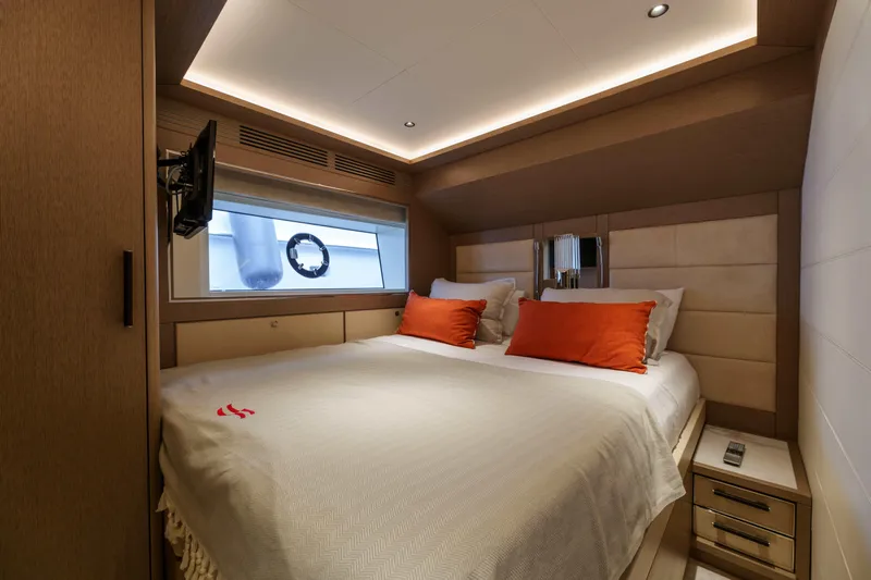 Heliophilia Yacht Photos Pics Luxurious cabin interior of 2024 Sirena 88 yacht with cozy bed and modern design.