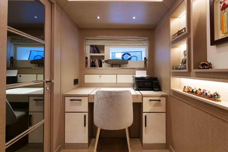 Heliophilia Yacht Photos Pics Luxurious study area in 2024 Sirena 88 yacht with modern desk and shelving.