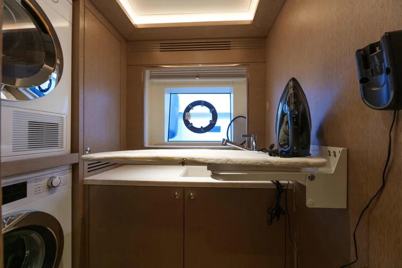 Heliophilia Yacht Photos Pics Laundry room with ironing board in 2024 Sirena 88 yacht.