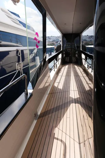 Heliophilia Yacht Photos Pics 2024 Sirena 88 yacht deck with sleek design and wooden flooring.
