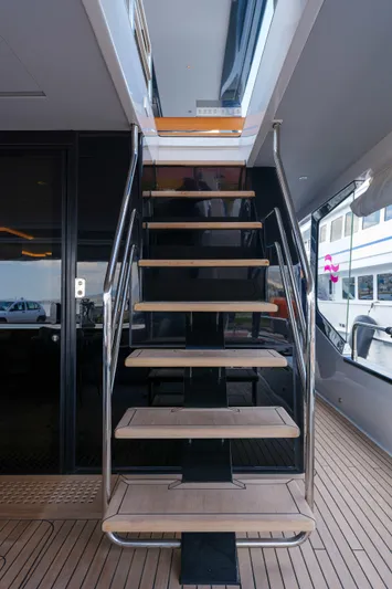 Heliophilia Yacht Photos Pics Staircase on 2024 Sirena 88 yacht, featuring sleek design and modern materials.