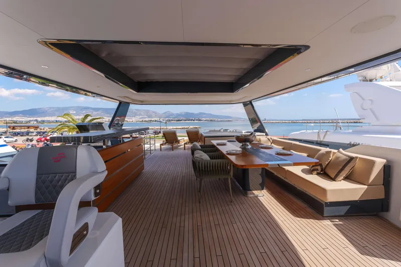 Heliophilia Yacht Photos Pics Luxurious 2024 Sirena 88 yacht interior with elegant seating and ocean view.
