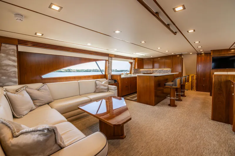 2020 Viking 80 Yacht Photos Pics Luxurious interior of 2020 Viking 80 Convertible yacht with elegant seating and wooden finishes.